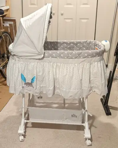 Very cosy and clean, this bassinet comes with battery-operated night light and music & ocean sounds...