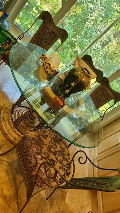 Solid wrought Iron table/glass top & 6 chairs, View more