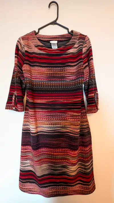 Women's size medium dress. Above the knee. Features three-quarter sleeves with button detailing. Str...