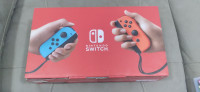 NINTENDO SWITCH BRAND NEW IN THE BOX WITH A NEW GAME