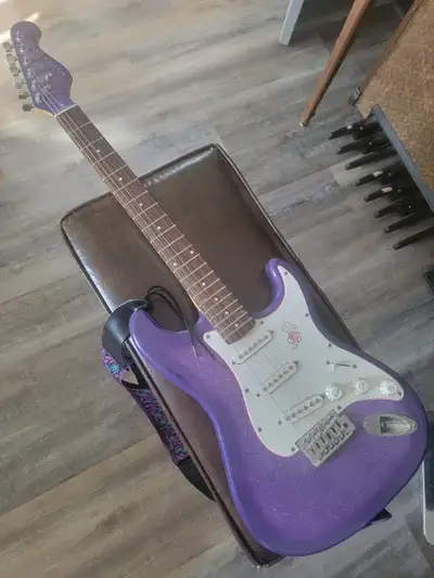 Purple Gypsy Rose Electric Guitar with New Shoulder Strap and Soft case Great Beginners Guitar. No A...