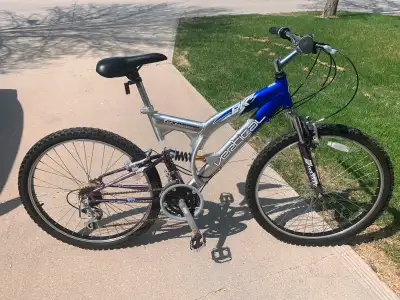 Dual suspension mountain bike, 26” wheels. 21 speed, quick release seat post, aluminum frame.