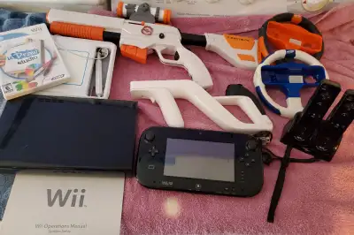 Comes with everything in pics Wii console + Wii U. 2 contols, guns & triggers, charging ports,14 gam...