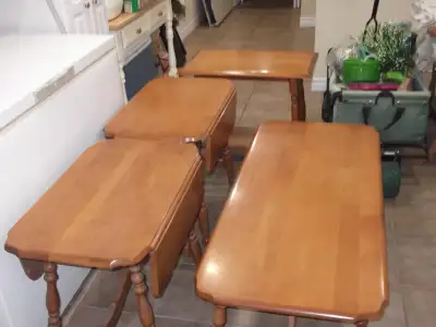 Coffee table and 3 end tables. Two of the end tables have fold outs. Hardwood and well made very stu...