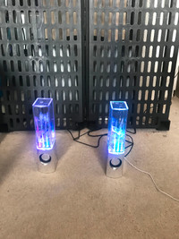 Speakers with lighted dancing water
