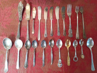Vintage cutlery spoons knives and forks.