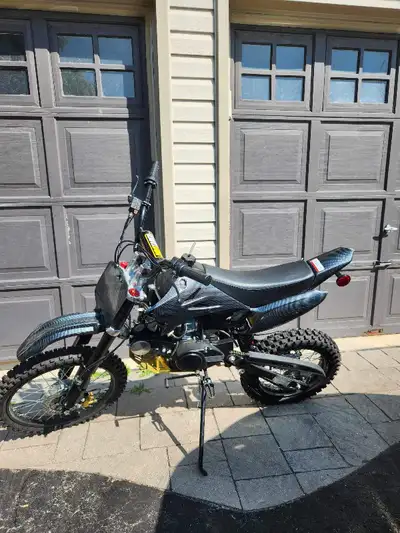 Lianmei LMDB 125 cc dirt bike. Like new, rode down the street a couple times. Too big for son. Recen...