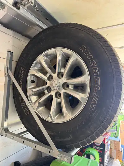 These USED Michelin Defender LTX M/S tires, sized 265/70R17, are mounted on Dodge alloy rims. I am s...