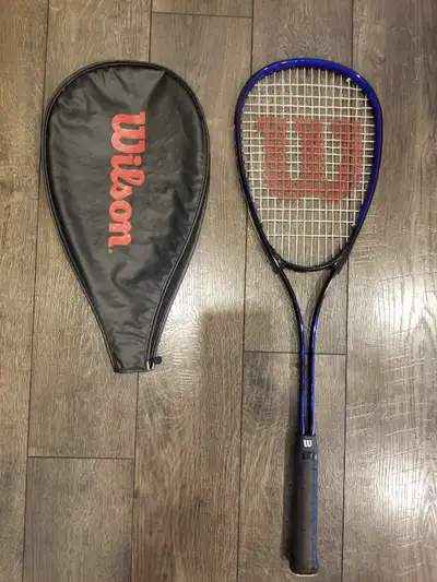 Like new Wilson Rally squash racket with case. $30.