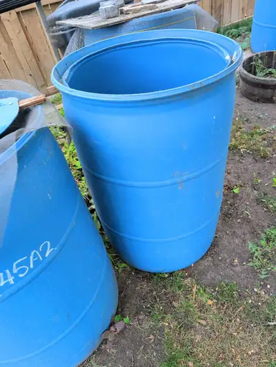 Several 50 gal blue plastic rain barrels. Top cut open and ready to go. Cash only please.