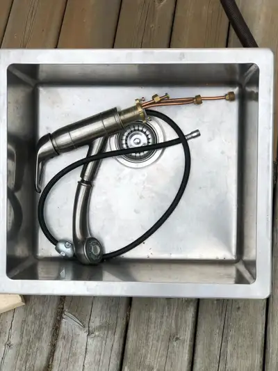 Stainless steel sink and tap. $20.