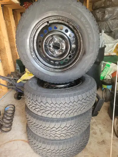 Set of four Goodyear Nordic winter tires, size 195/70R14 91S, on 14 inch steel rims.5x100 bolt patte...