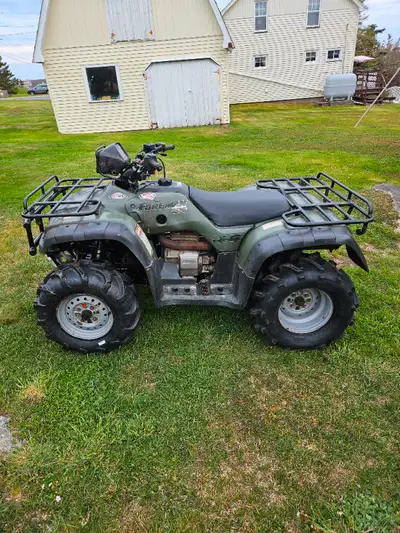 Very nice 2001 honda 450 with papers and winch that has had close to 2000$ in brand new parts put on...