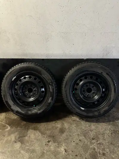 Set of 4 winter tires 205/60R16 Set of 4 black steel rims installed and included Pick up at Dufferin...