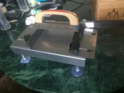 Brand new meat slicer with an extra blade and other accessories and guide book in original box has n...