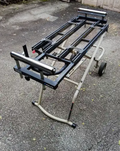 Steel frame. Foldable. Rollable. It was used for a Sliding Compound Mitre saw. Used but it is good.