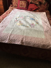 Hand sewn pink baby quilt