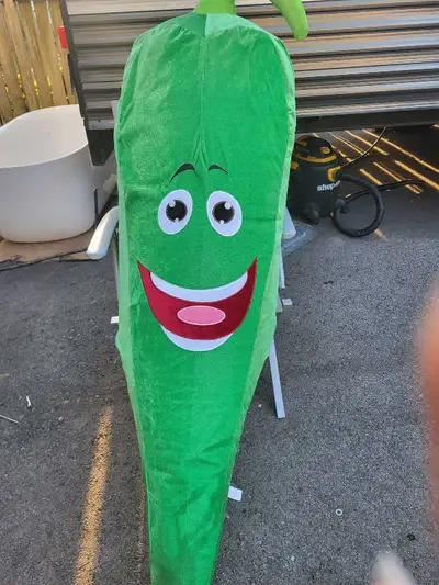 Selling a green inflatable giant pepper.