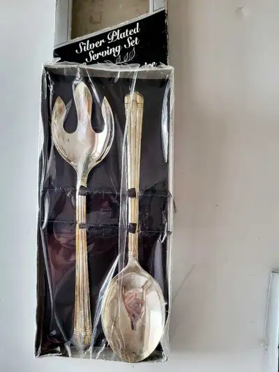 This new silver plated serving set includes a fork and spoon, perfect for adding a touch of elegance...