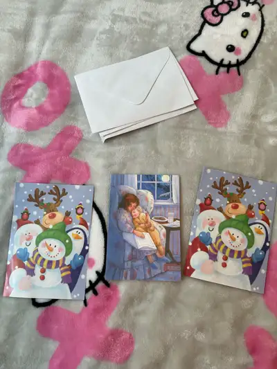  Christmas cards and white envelopes (snowmen, Santa, View more