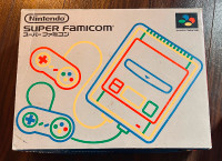 Japanese Super Nintendo (Super Famicom) CIB system with games.