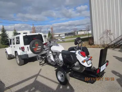 Used only 4 times…been stored in garage and this trailer folds up for easy storage