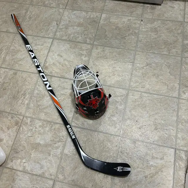 A hockey helmet and hockey stick for sale with free roller skate in Hockey in Winnipeg - Image 3