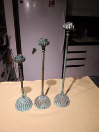 Set of 3 brass candle holders.16", 13" and 11" tall.