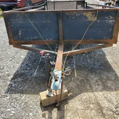 Utility Trailer 12' 6" long and 6' wide. The black one is 13' long and 6' 6" wide. solid hardwood fl...
