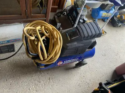 For sale 8 gallon Campbell hausfeld air compressor on wheels and handle new long hose,lightly used g...