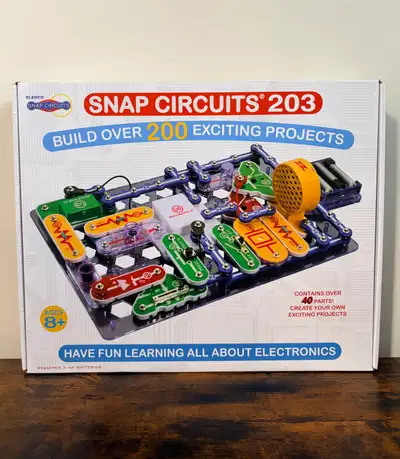 Dive into the world of electronics with this Elenco Snap Circuits 203 set, which allows you to build...