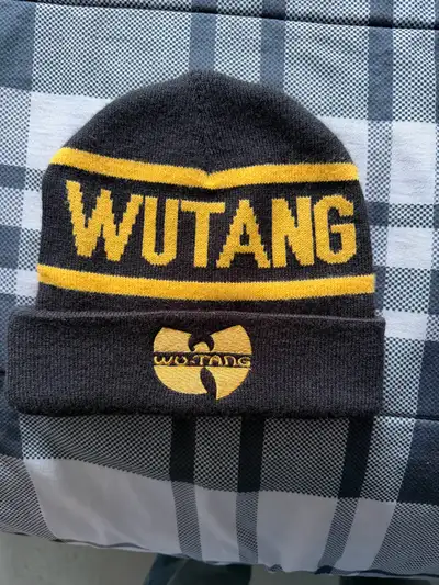 This Wu-Tang Clan hat is a stylish nod to the iconic hip-hop group. With its bold lettering and embr...
