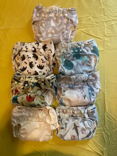 These are used Mother ease diapers in great condition, barely used. No stains as did EC and mostly d...