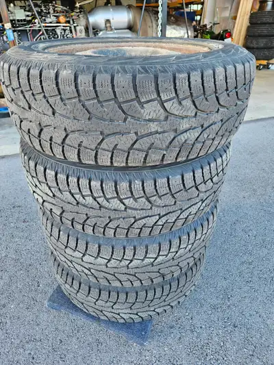 Four tires with steel rims, fit Nissan Pathfinder