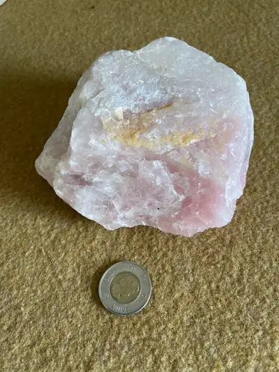 One kilogram of raw rose quartz, featuring natural, unpolished crystals with a soft pink hue, perfec...