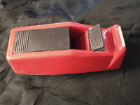 Heavy duty weighted red tape dispenser