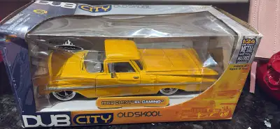 I'm selling a used DUB City Old Skool 1969 Chevy El Camino diecast model. This striking yellow El Ca...