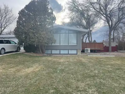 Updated bungalow on a large lot, across from tot lot (spray park) in Coaldale. New tankless hot wate...