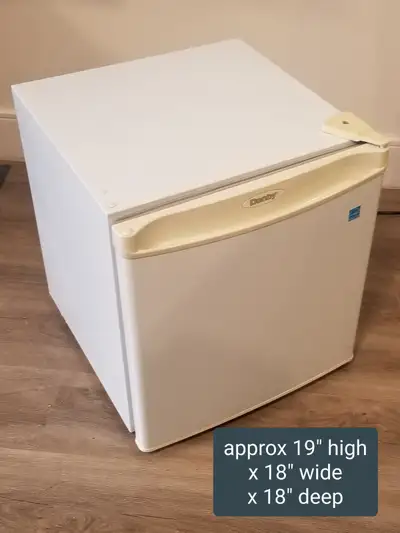 Working Danby Mini Fridge. Approx 19" high x 18" high x 18" deep, View more
