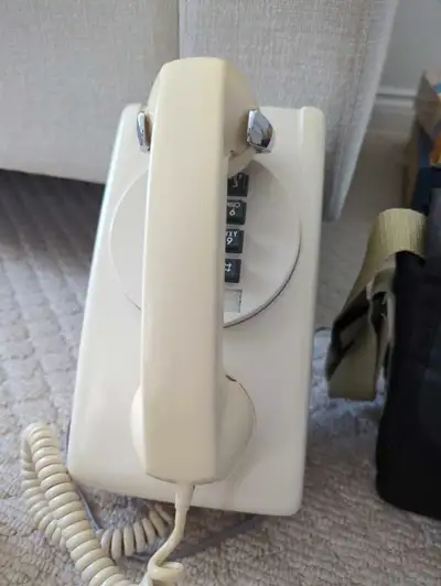 Vintage items Wall hanging phone $30 Nikon camera $25 Am/fm radio battery based $15