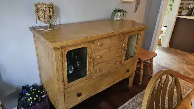 Antique all original hutch. 100 years old Everything works. Wooden buttons on glass doors. Metal whe...