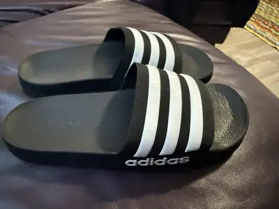 Get ready for summer with these Adidas Slides in a youth size 5! They are in great condition with lo...