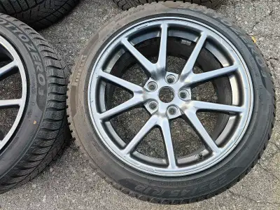 Off 2022 set of 4 original 18" Tesla model 3 rims with Pirelli winter tires on them 235/45/R18. Rims...