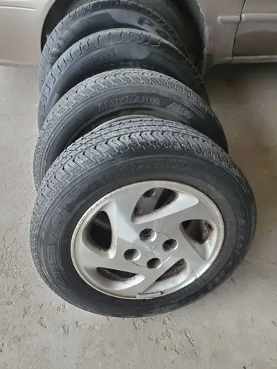 Alloy wheels with 2 motomastertyres 2 pirelli all wheather tyres. Fits on corrolla 1998 - 2002 Yaris...
