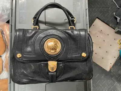 This Black leather Juice Couture purse is an authentic piece that comes with its dust bag. In excell...