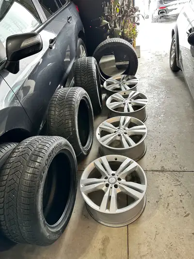 Selling a complete set of Mercedes-Benz OEM rims with winter tires, used for only one winter season....