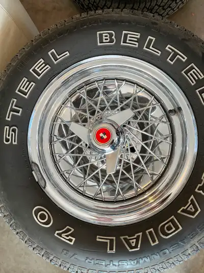 **One wheel is bent, missing wire basket and spinner** 3 good wheels with center caps, wire baskets...