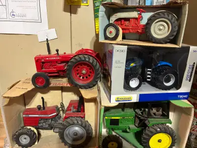 Five toy farm tractors for sale. Need to make room in the garage. Massey Ferguson 398 McCormick WD –...
