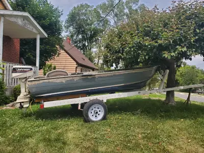 OBO 12 ft boat, floats 1990 4hp Johnson, motor runs beautifully Tilt load trailer with new tires. 5i...
