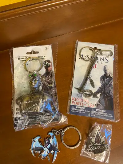 NIP Tom Clancy's Splinter Cell Blacklist Sam Bust and Assassin's Creed II Key Chains. These are new...